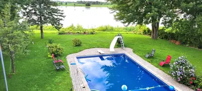 an overhead view of a swimming pool in a yard at Lady Eden Waterfront Mansion - No party in Montréal
