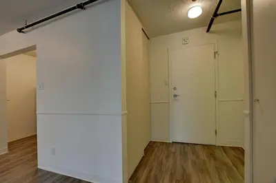 an empty room with a closet and a door at Laval stays 31 days minimum in Laval