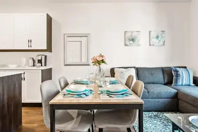 a living room with a table and a couch at Le Mile End by M11 - Modern 1 BDR Unit with Sofa Bed in Montréal