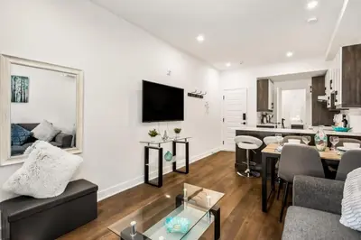 a living room with a couch and a table at Le Mile End by M11 - Upscale Comfy Studio in Montréal