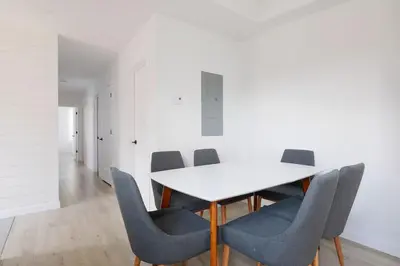 a dining room with a white table and chairs at Bromont Lodge 837 shefford suite 200 in Bromont