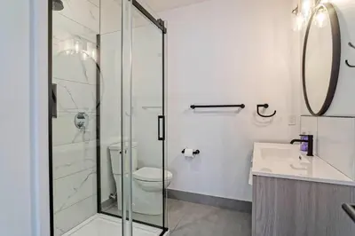 a bathroom with a shower and a toilet and a sink at condo 3 chambres vue sur la montagne 837-202 in Bromont