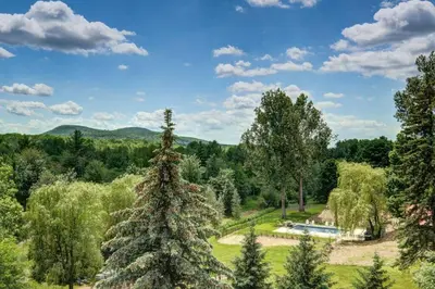 an image of a tree in the middle of a field at 201 Condo au rez de chaussée , au coeur de Bromont in Bromont