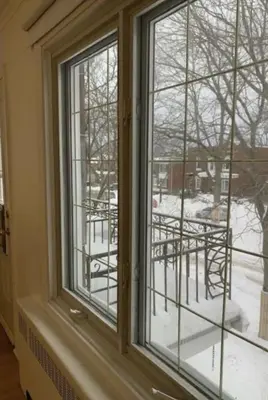 a window with a view of a snow covered yard at Free Parking, Beautiful 4 1/2-2 BR apartment in Montréal