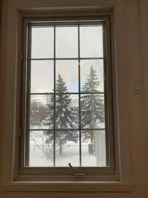 a window with a view of a snow covered tree at Free Parking, Beautiful 4 1/2-2 BR apartment in Montréal