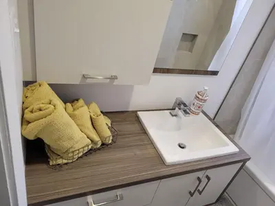 a bathroom with a sink and a mirror at Free Parking, Beautiful 4 1/2-2 BR apartment in Montréal