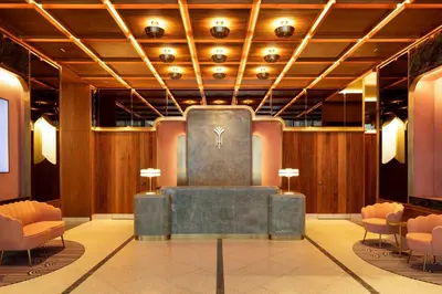 a lobby with a statue in the middle of a room at HONEYROSE Hotel, Montreal, a Tribute Portfolio Hotel in Montréal