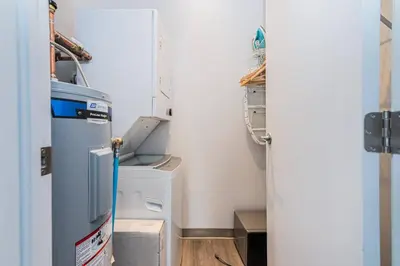 a laundry room with a washer and dryer at Amazing New Apartment Close to Mount Royal Le Plateau by Denstays in Montréal