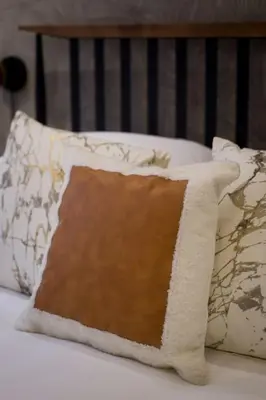 a pillow sitting on top of a bed at Palms Little Italy Studio with full bathroom by Denstays in Montréal