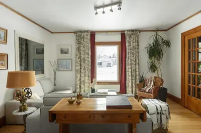 a living room with a couch and a table at Maison Sherman's house in Scotstown