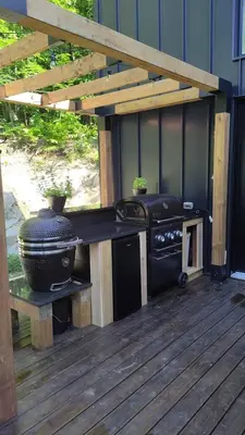 a grill sitting on a deck with a stove at Magnifique Chalet En Montagne in Shefford