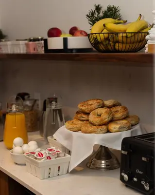 a bunch of bagels and eggs on a counter at Le Petit Hotel Notre Dame in Montréal
