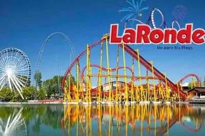 an amusement park with a roller coaster and a ferris wheel at Simplement l’Harmonie à Chambly in Chambly