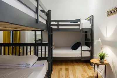 a room with two bunk beds and a table at The Parkview By MTLVacationRentals in Montréal