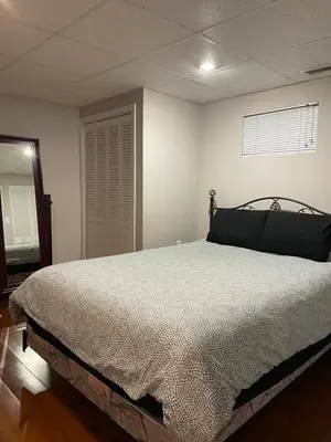 a bedroom with a bed in a room at Oasis in Ascot Corner