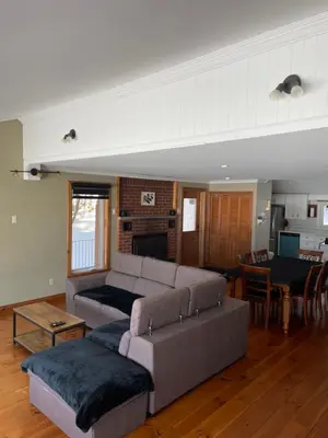a living room with a couch and a table at Oasis in Ascot Corner
