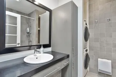 a bathroom with a sink and a mirror at STUNNING full APARTMENTS - stocked KITCHENS - WASHER & DRYERS - WORKSPACE PROVIDED - FAST WIFI - LOCATED on the FAMOUS ST Denis street - Near METRO MONT ROYAL in Montréal