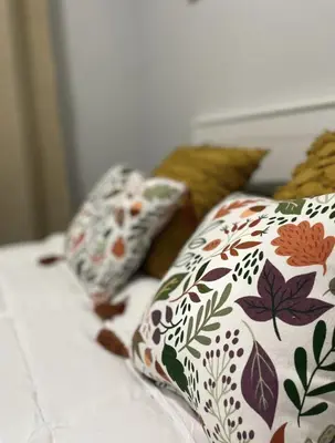 a bed with pillows on top of it at Fantastique 3 chambres modernes au cœur de la ville in Montréal