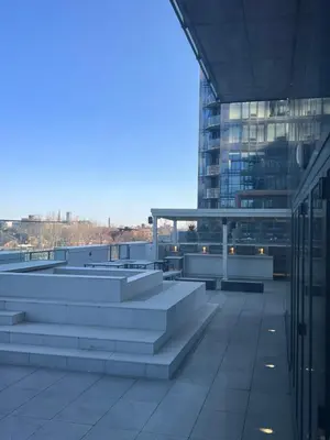 a building with stairs in front of a building at Beautiful one bedroom downtown Condo with pool and free parking in Montréal
