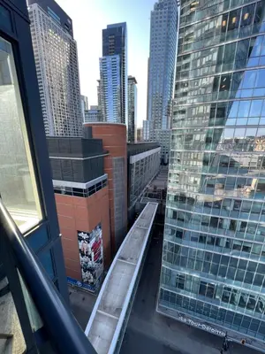 a balcony with a view of a city at Beautiful one bedroom downtown Condo with pool and free parking in Montréal